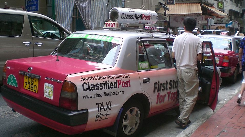 Hong Kong Central Taxi with South China Morning Post advertising