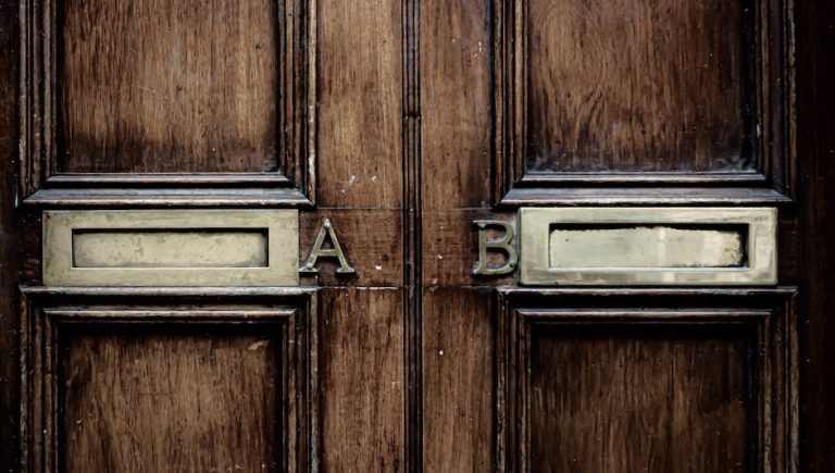 A and B letterboxes on a door in Ireland. Photo by Jason Dent on Unsplash