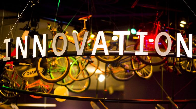 An Innovation sign hangs in a bike shop. News companies are using discovery processes and frameworks to deliver innovative products.
