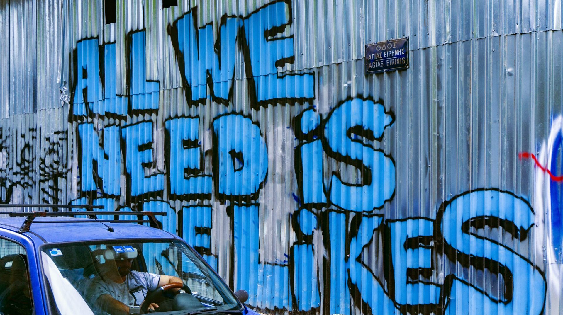 Graffiti in Greece that says 'All we need is more likes'. Stung by social media reverses, publishers are thinking more clearly about the value exchange with platforms. Photo by Daria Nepriakhina from Unsplash