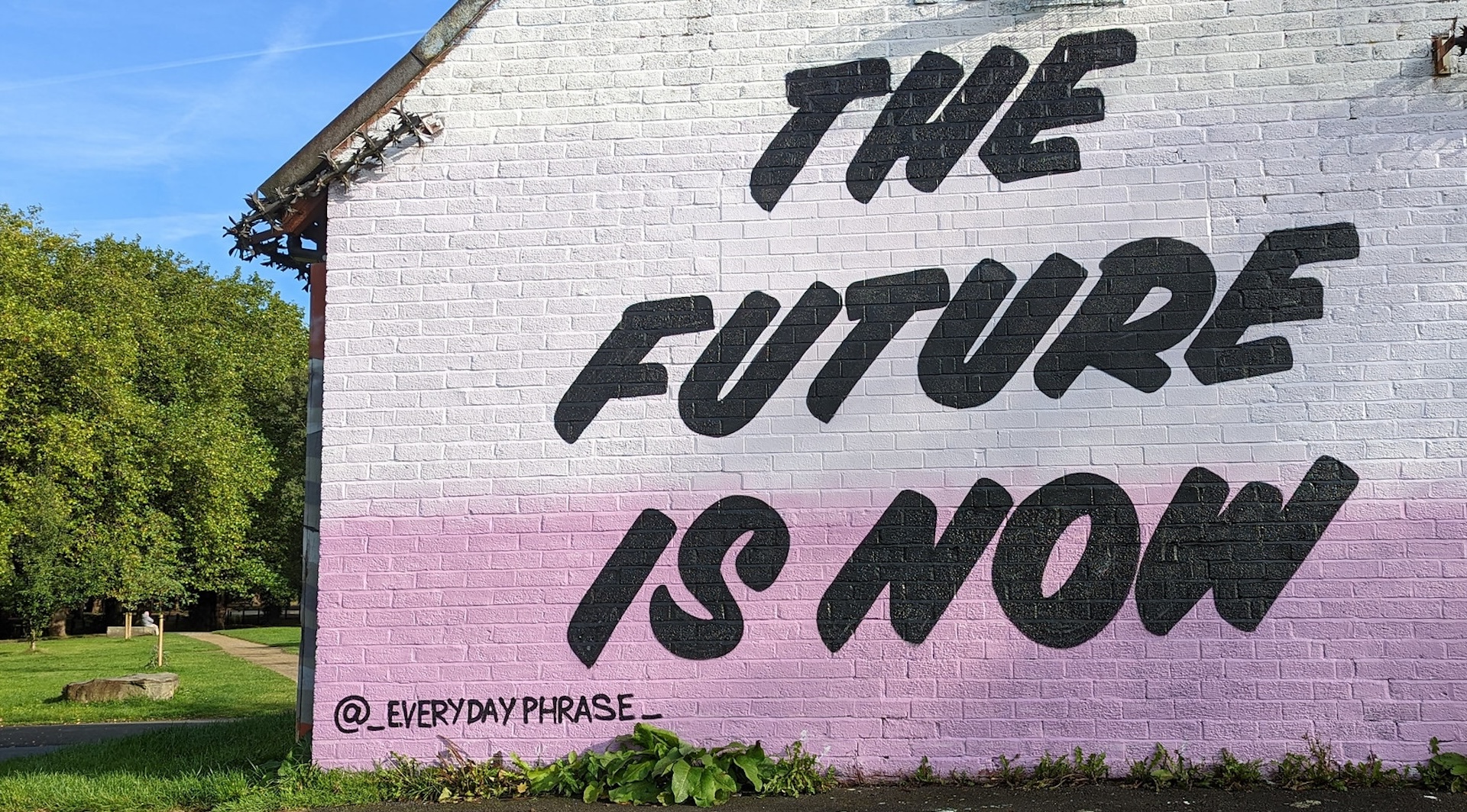 An image of a building with "The Future is Now" painted on its side. Publishers are anxious about 2024. We see opportunities in rethinking and rebalancing their approaches to audience acquisition, reader revenue and AI. Photo by Dunk from Flickr