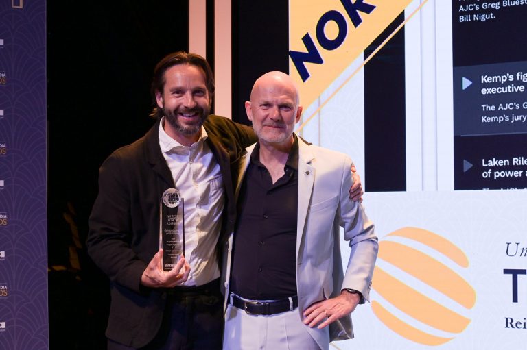 Jonny collecting the award on AJC's behalf
