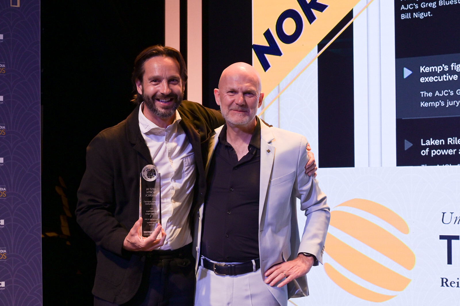 Jonny collecting the award on AJC's behalf